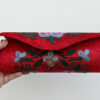 Red Cylindrical Shaped Clutch with Aari Embroidery